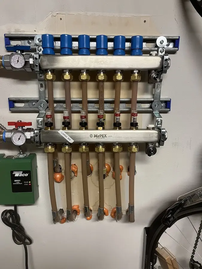 Plumber performing Water Heater Repair at a residential property in Emma